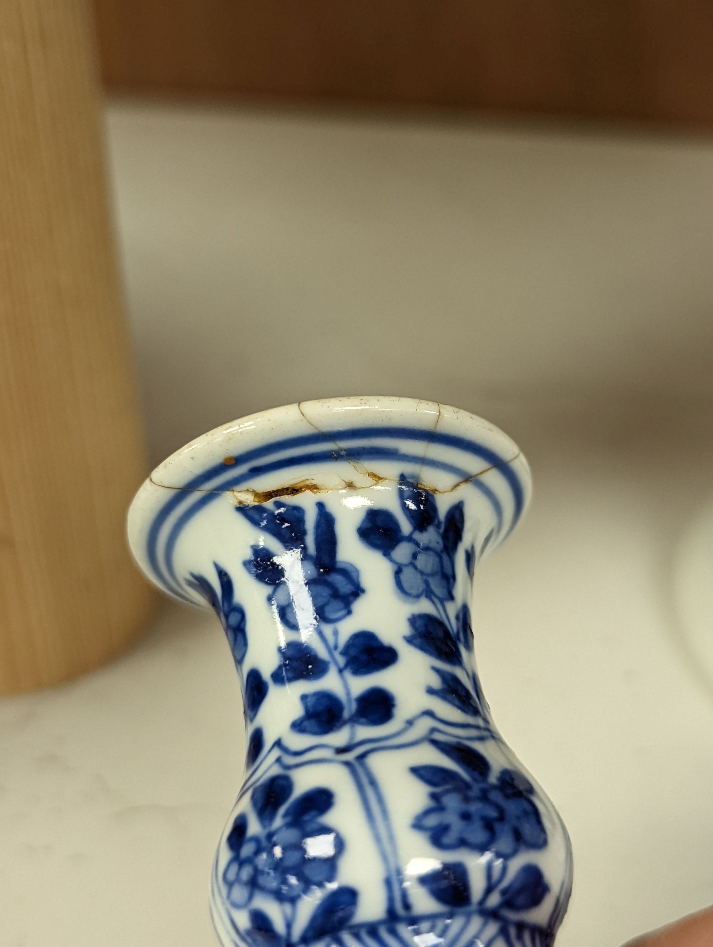 A Chinese blue and white vase and cover, Kangxi mark, 19th century, 26.5cm tall, and a Chinese Kangxi period small vase (2)